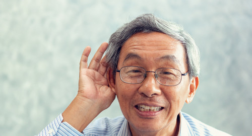 aspire blog - Medicare hearing benefit - adult man trying to hear