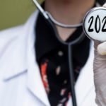 Aspire Blog - Medicare Updates for 2022 - Doctor holding a stethoscope with 2022 written on it