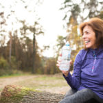 Women stays active in the winter by exercising and hydrating