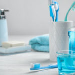 Photograph showing toothbrush and mouthwash, items important to maintaining oral health